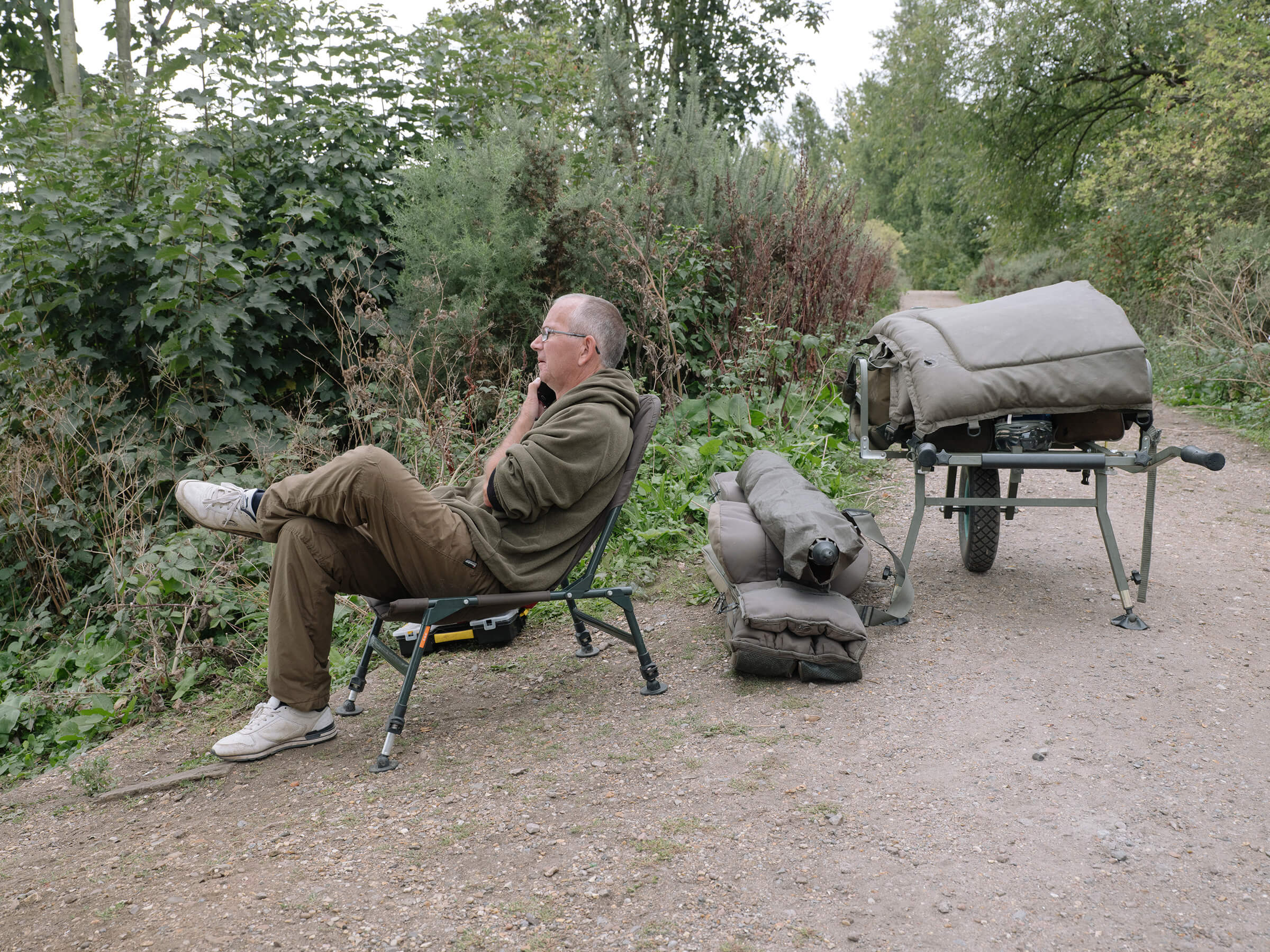 Man sitting on camping chair
