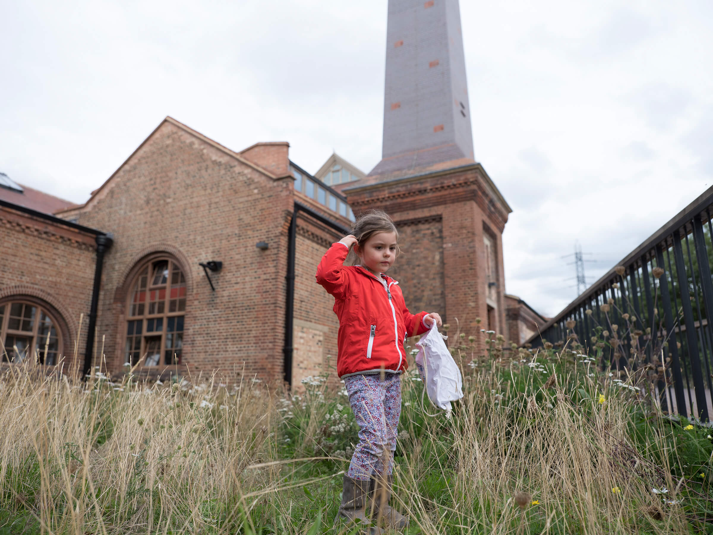 Young child in front of pumping station