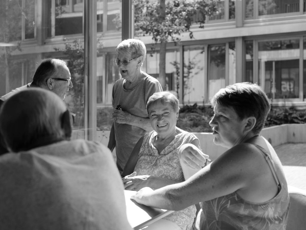 Residents in conversation at Almshouse